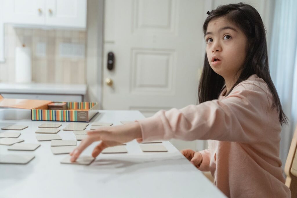 a girl with special needs playing
