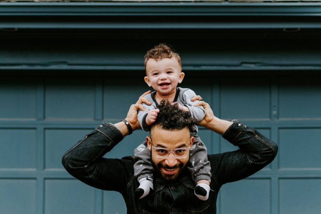 father carrying his son