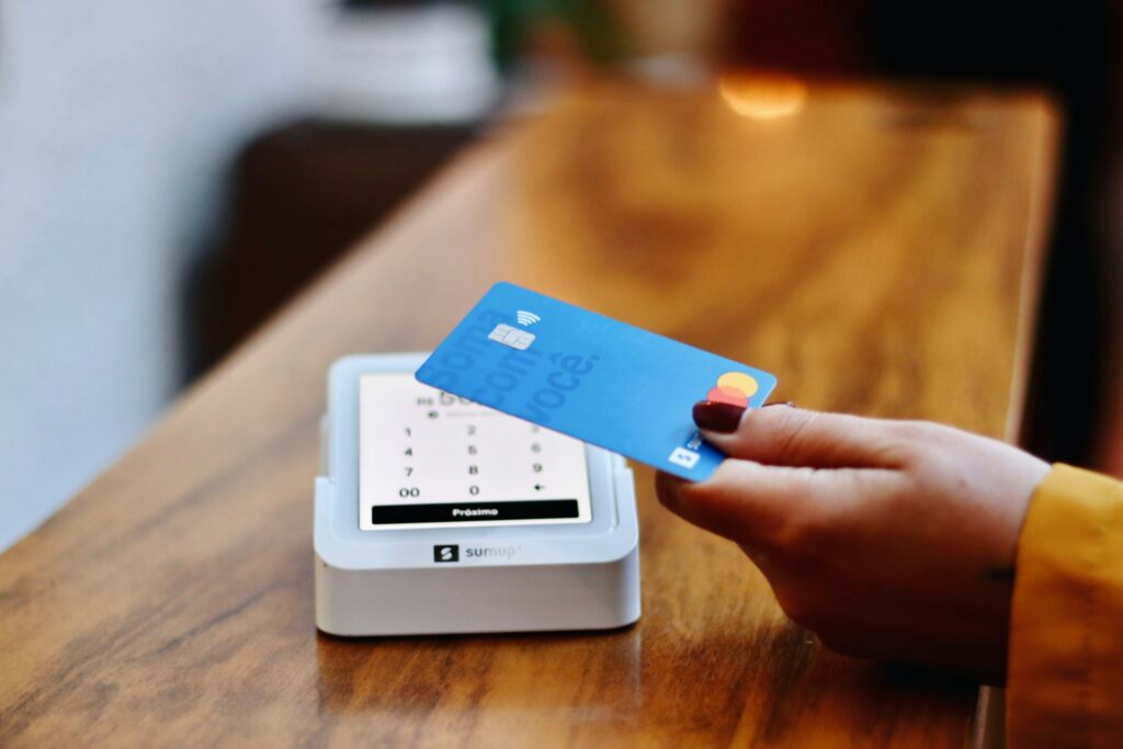 person holding credit card