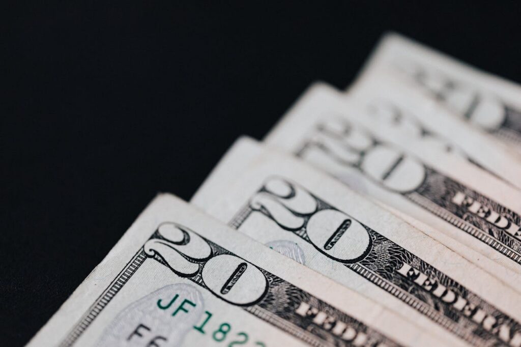 pexels-karola-g-4386374 close up photo of 20 dollar bills