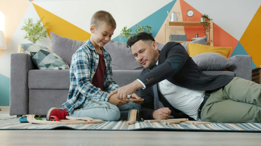 father and son playing blocks