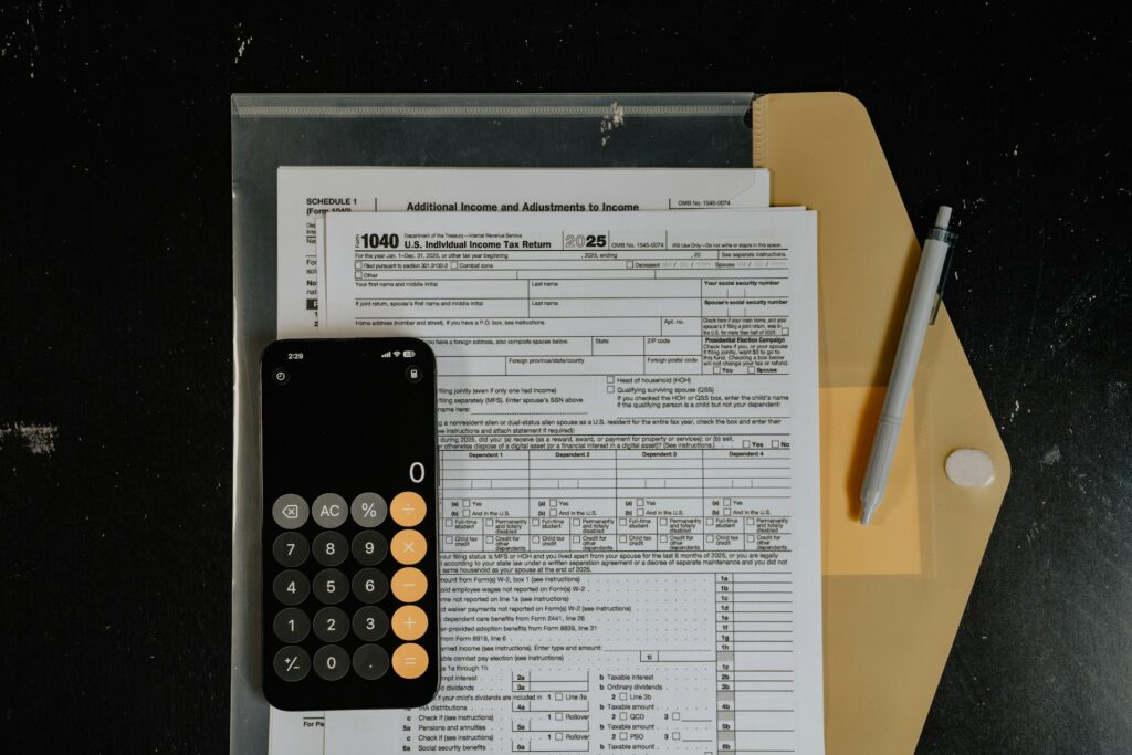 tax forms, calculator and pen