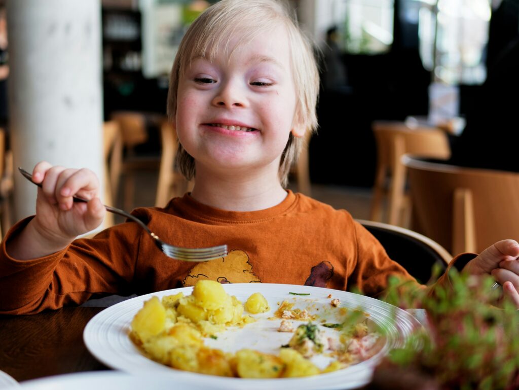 pavol-stugel-YLNgzGPxnuk-unsplash a special needs child eating