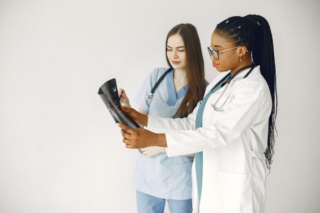 medical professionals reading xray