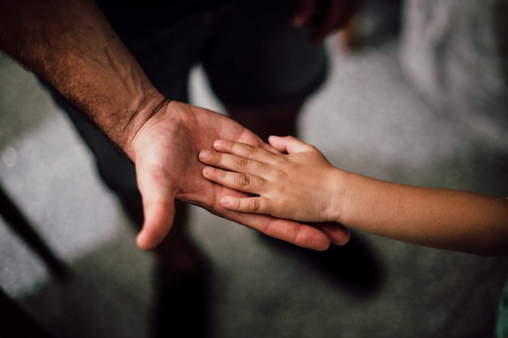 father and child's hands
