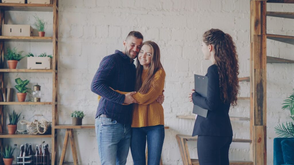 couple meets with real estate agent