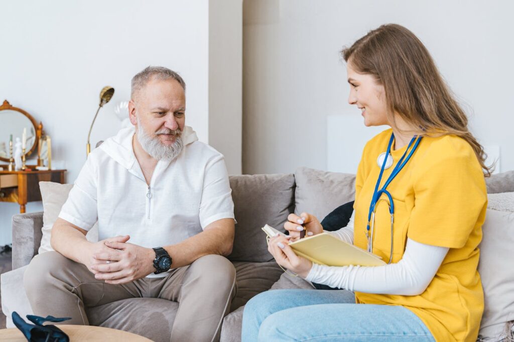 healthcare professional talking to a man
