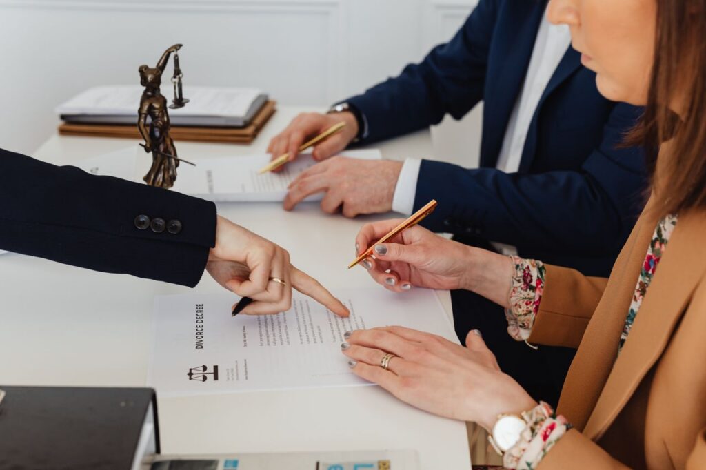 couple signing divorce decree