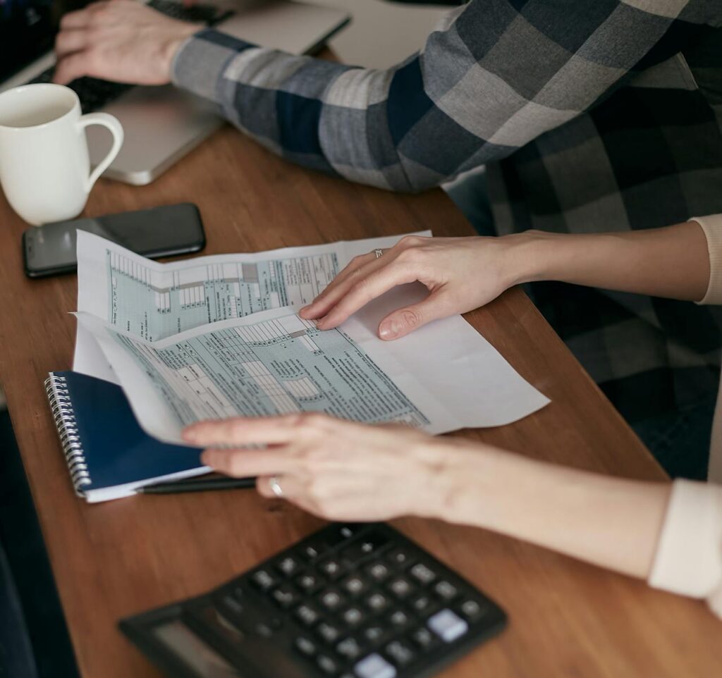 person holding financial documents