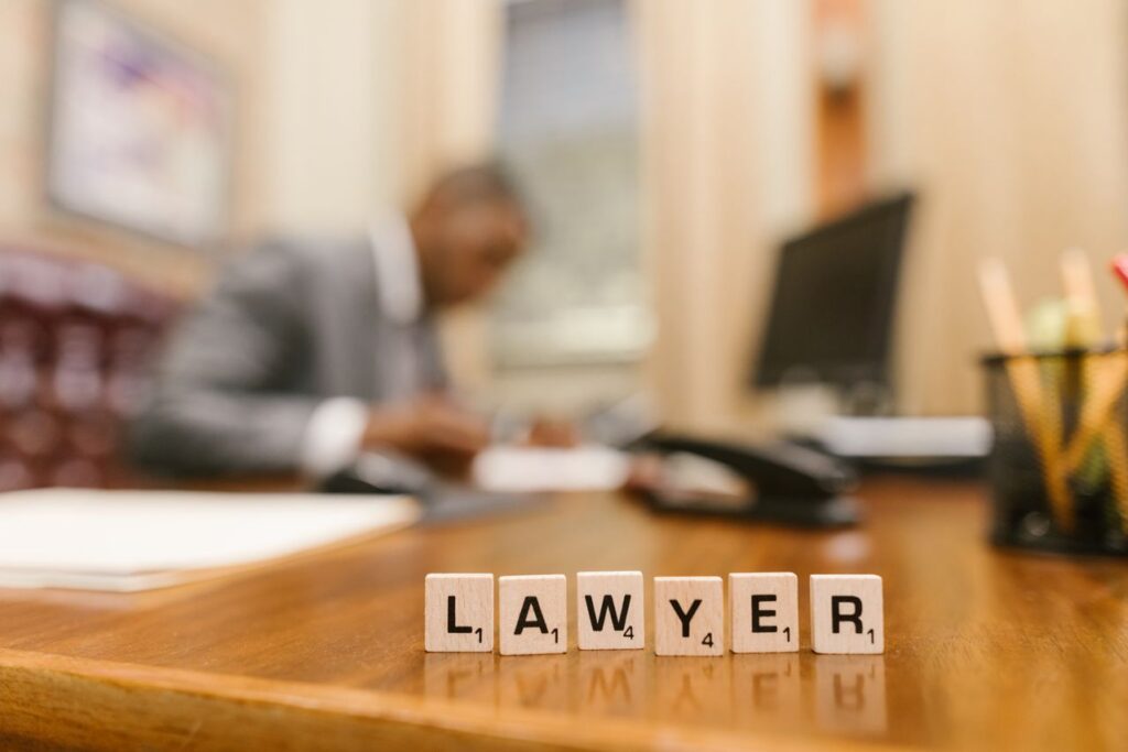 scrabble tiles with the word "lawyer"