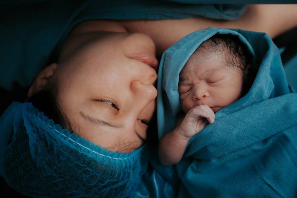 woman with her newborn baby