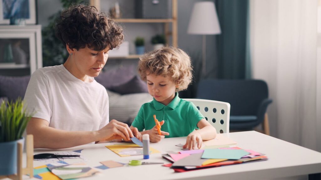 parent and child doing craft