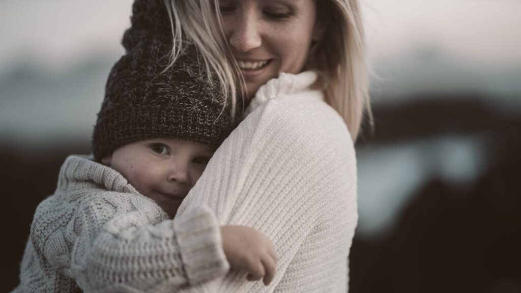 woman carrying a child