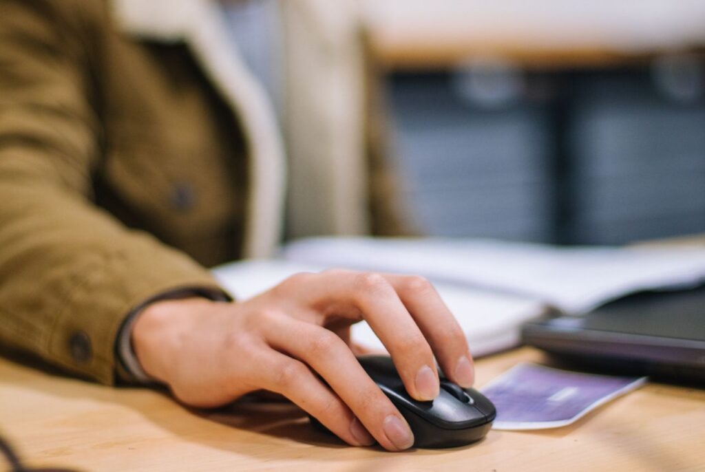 pexels-jeswin-4126989 person using a cordless mouse
