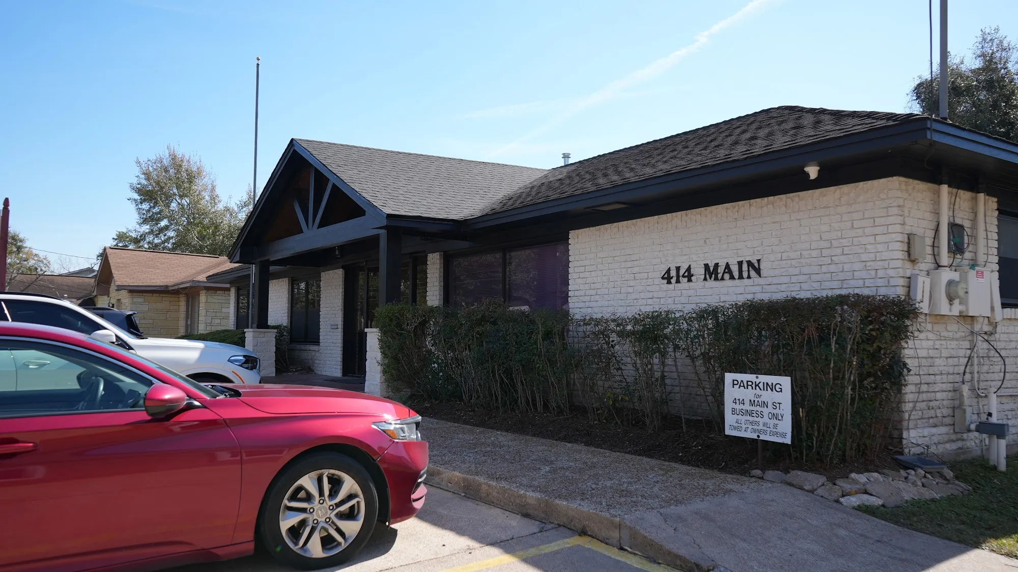 Exterior of the Law Office of Bryan Fagan, PLLC Humble Office at 414 Main Street, with parking in front of the building.