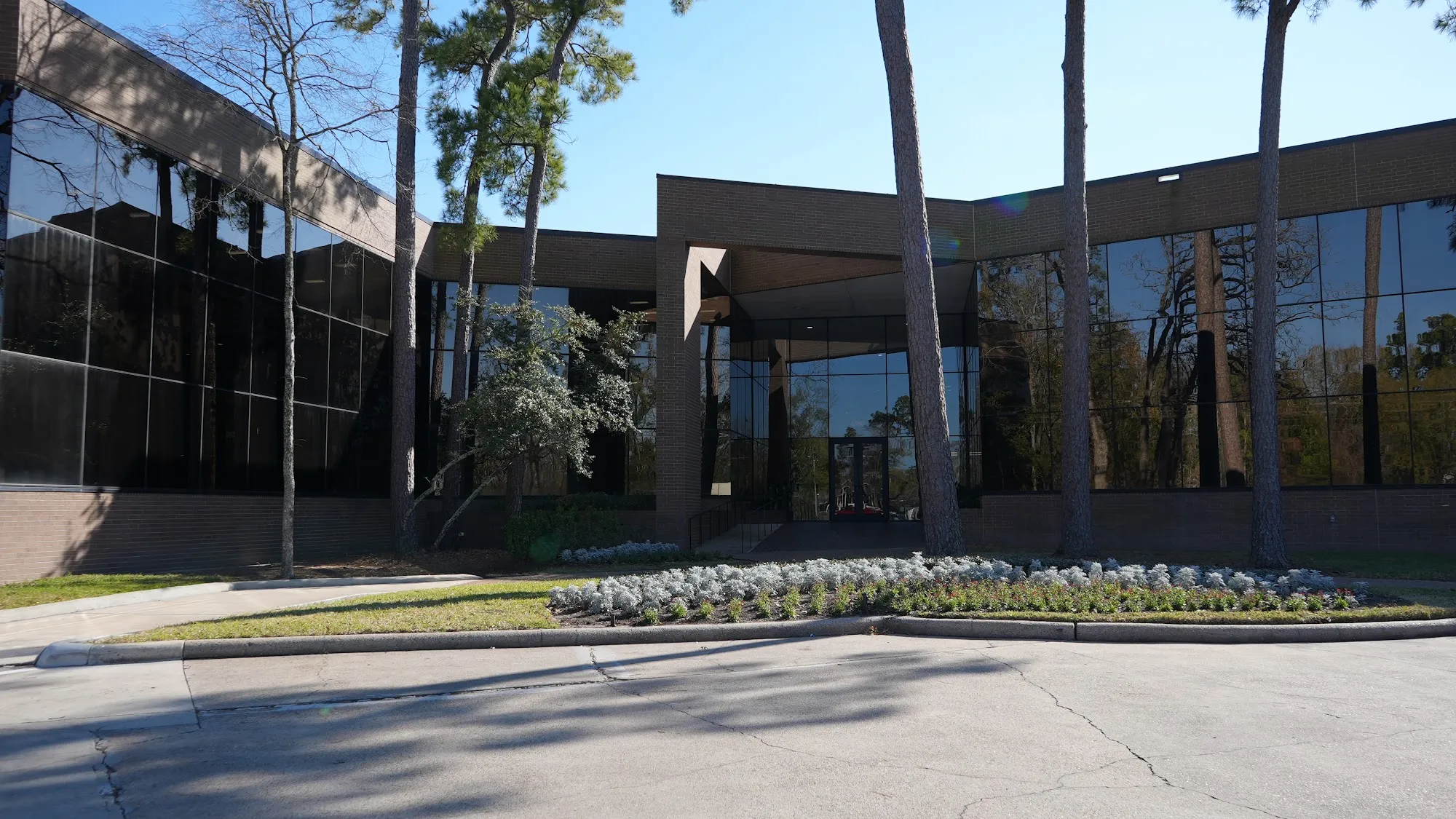 Modern glass and brick office building exterior at Kingwood law office