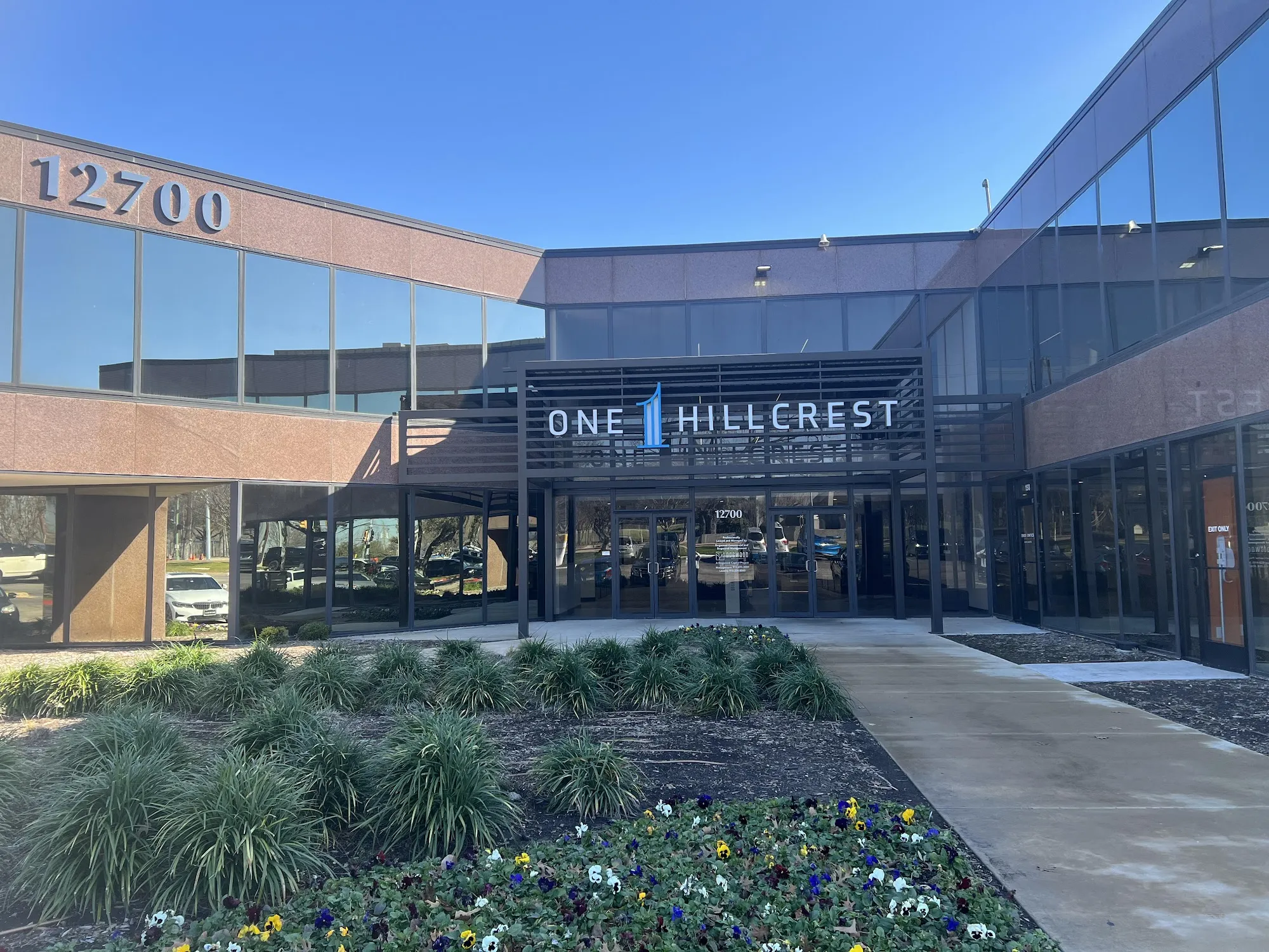One Hillcrest office building entrance at 12700, Dallas law office