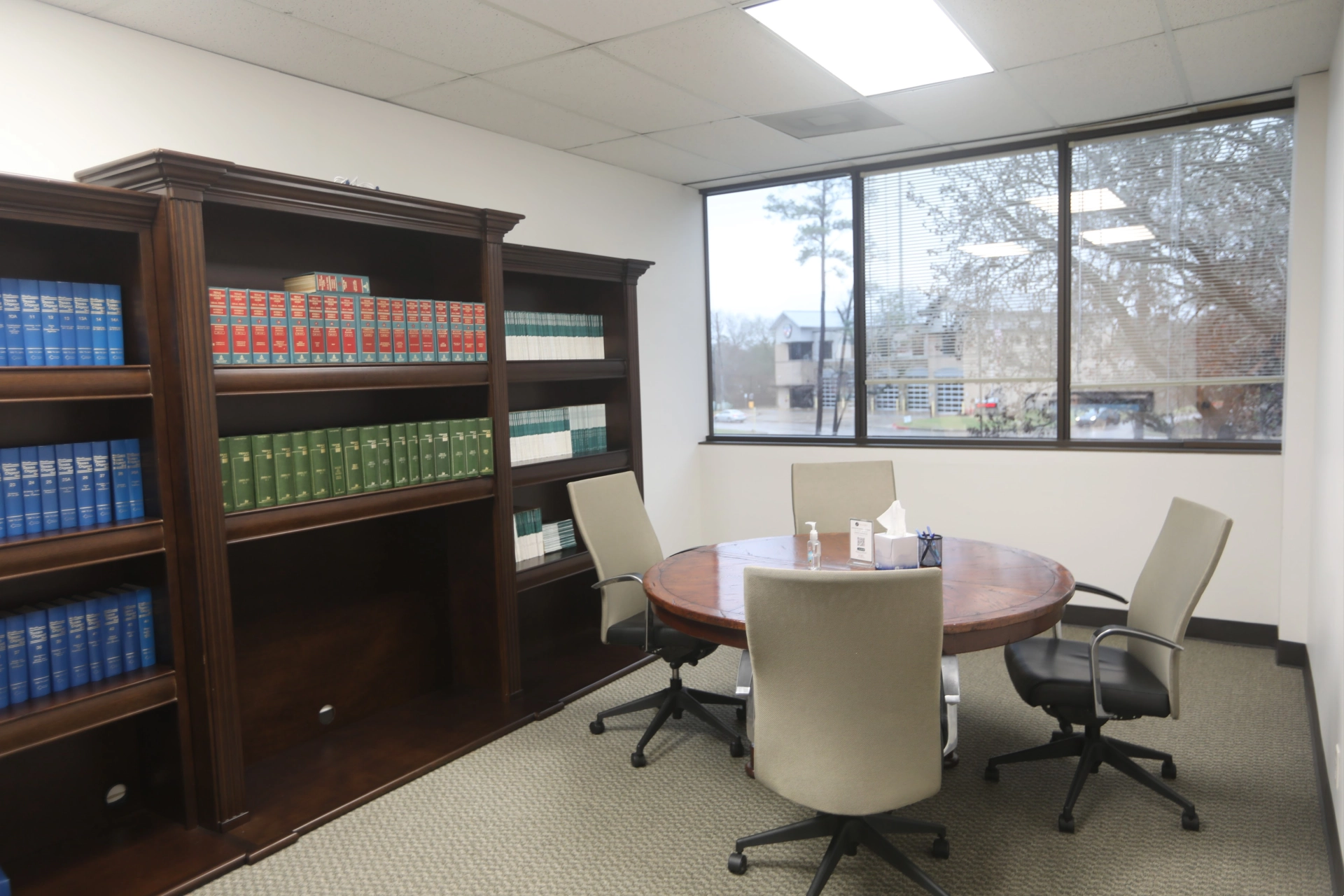 Consultation room at Atascocita office with table, chairs, and bookcase