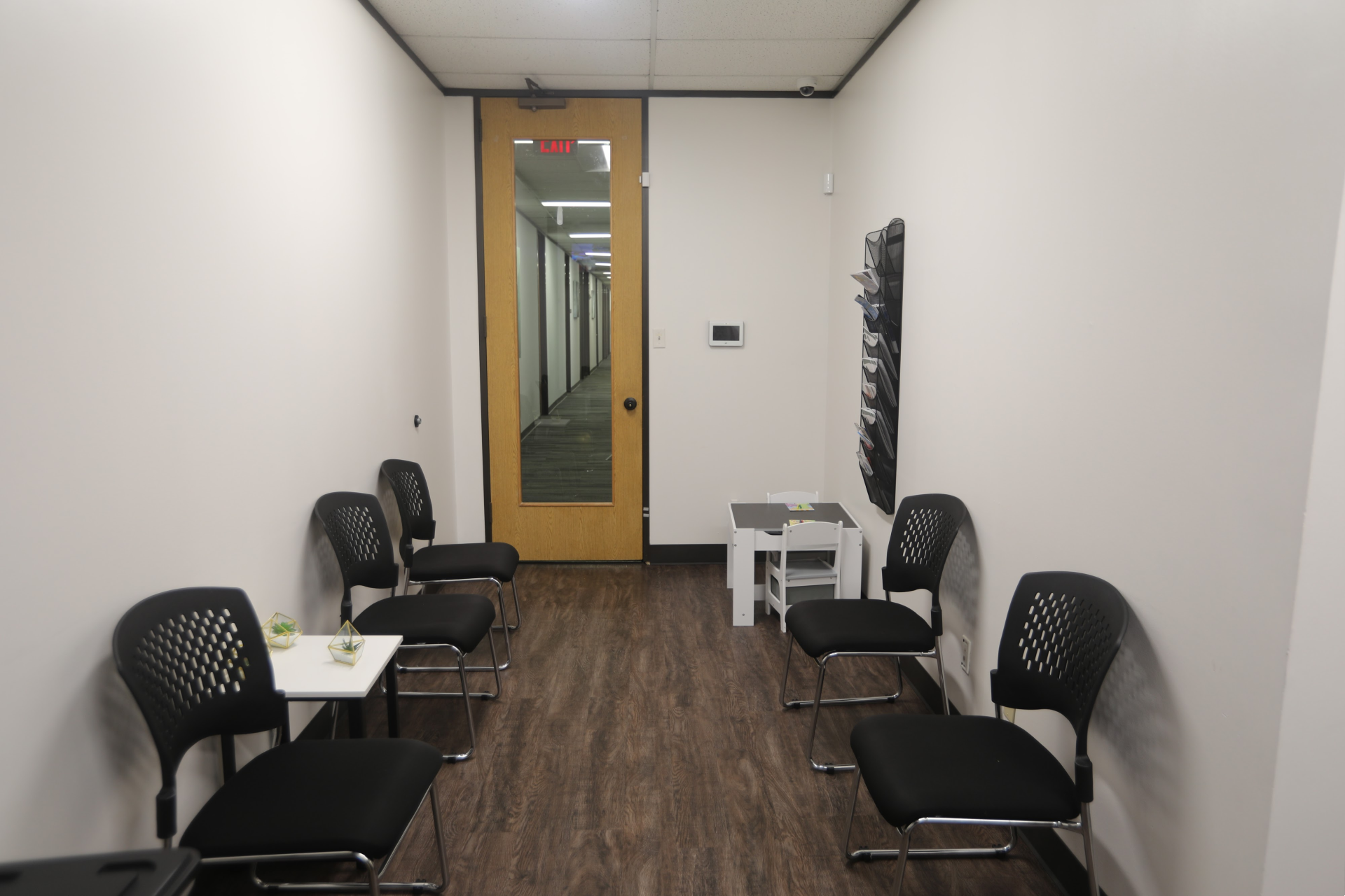 Waiting area at Atascocita office with chairs and hallway access