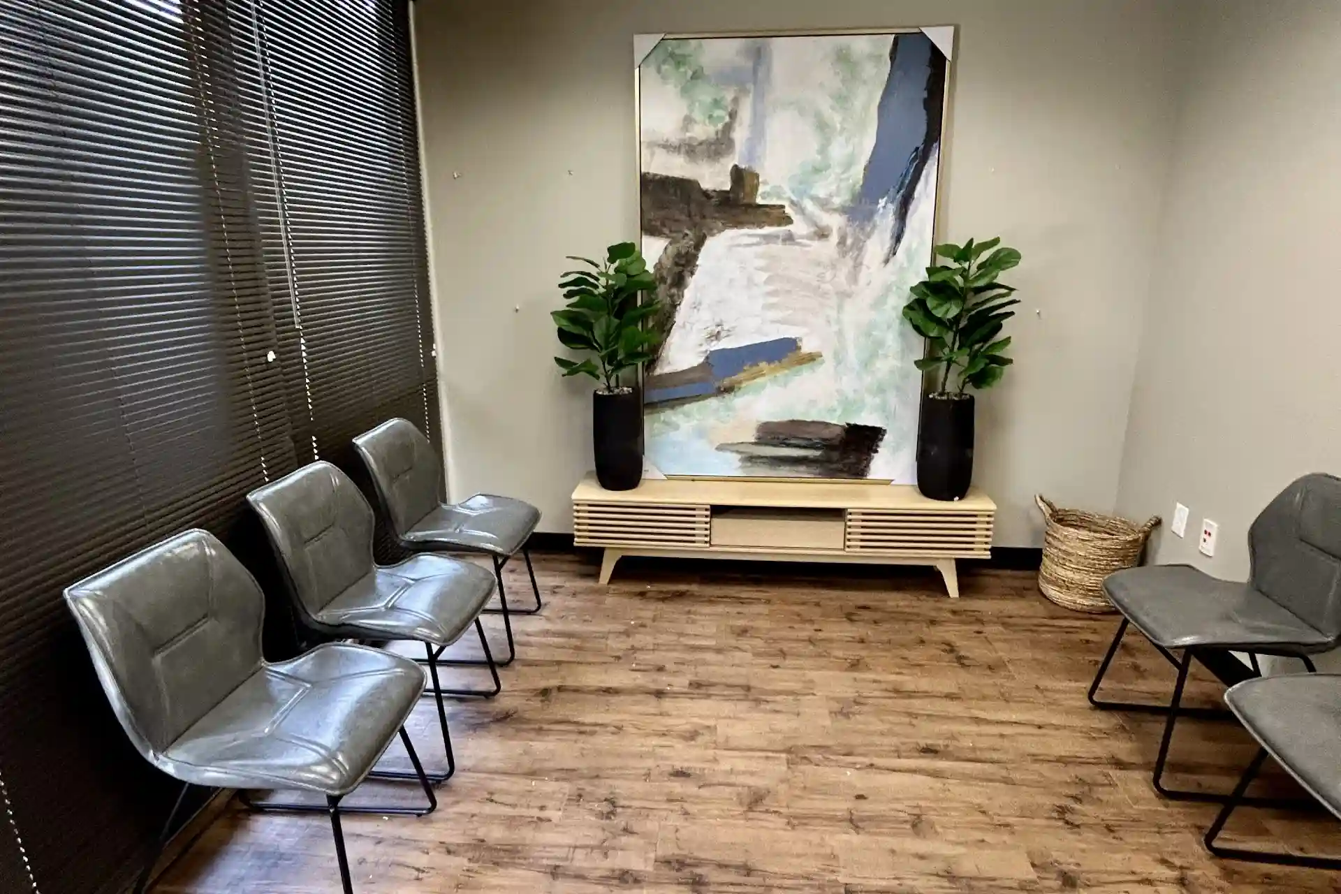 Office waiting area with chairs, artwork, and seating space