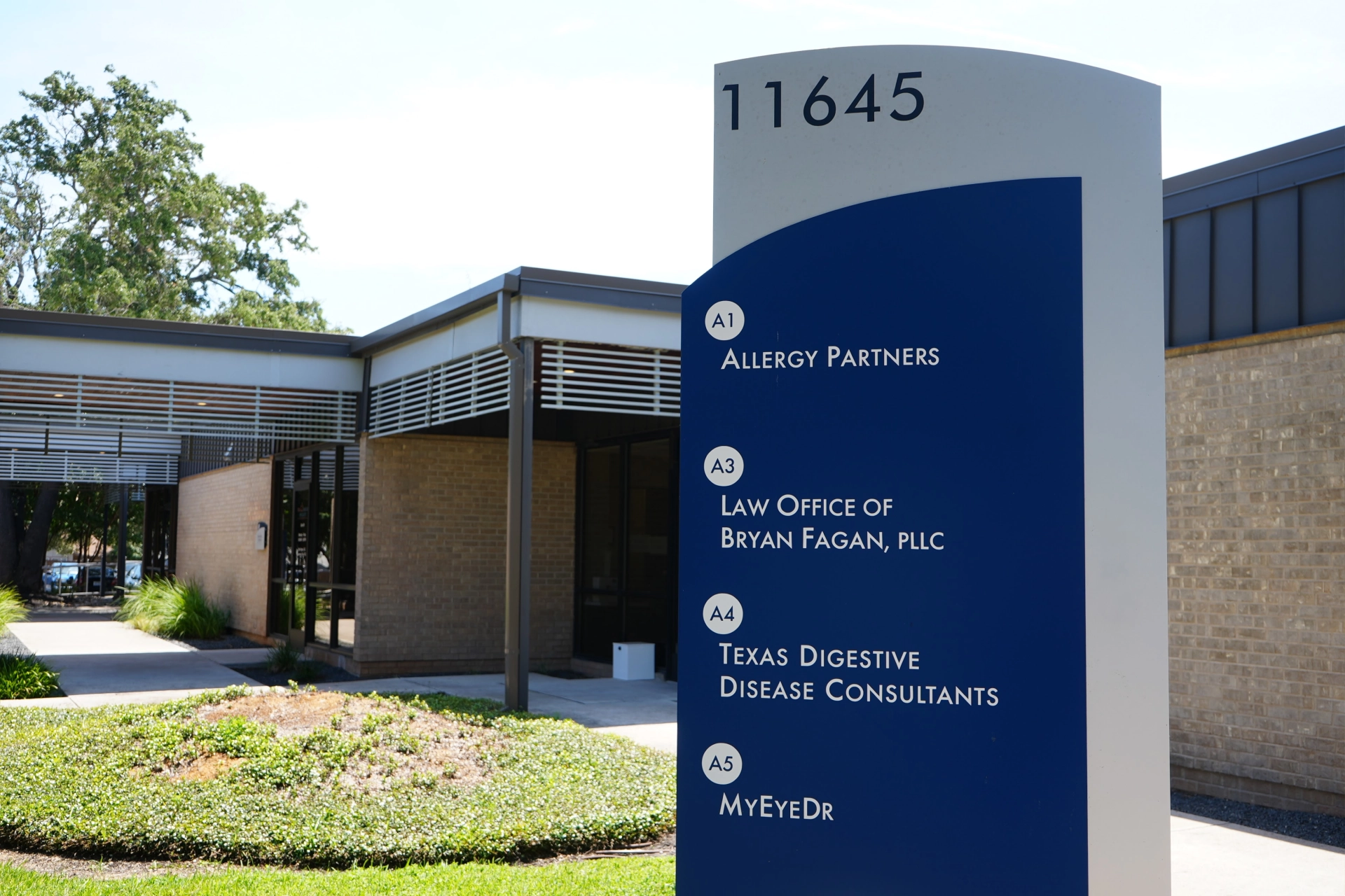 Directory sign showing Austin office location at Twelve Oaks Professional Center