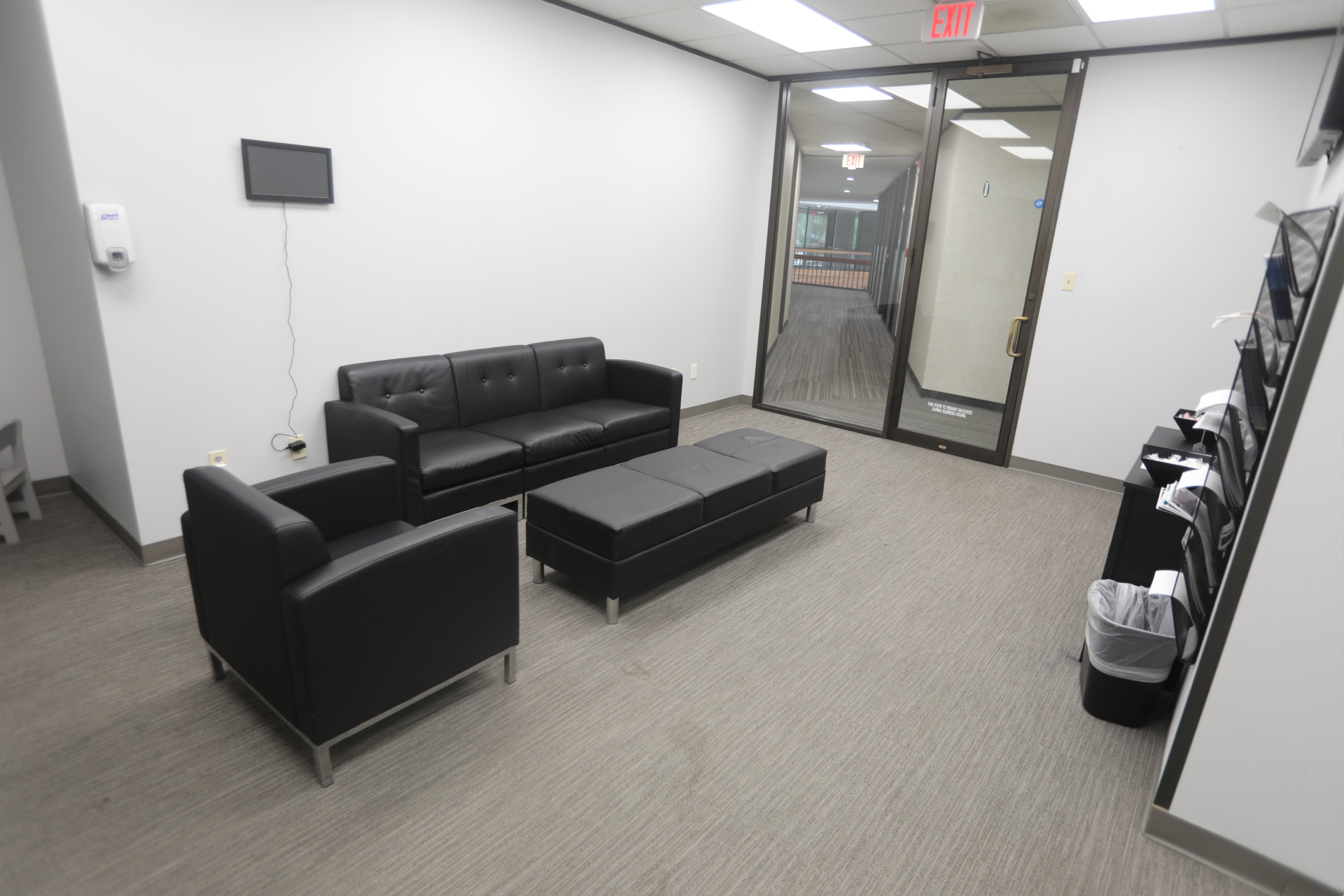Waiting area at Kingwood office with seating and hallway entrance