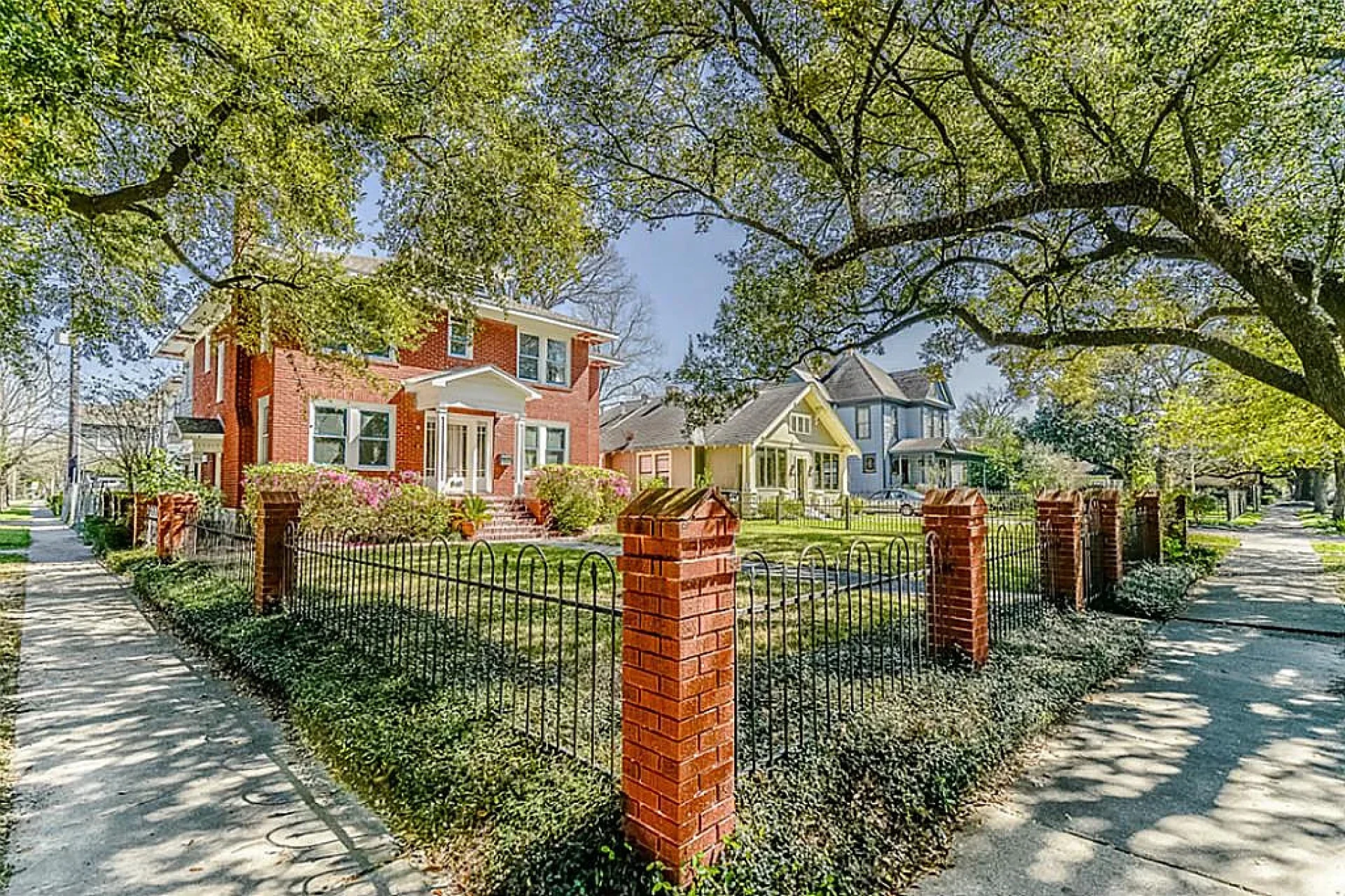 Exterior view of the Heights office surrounded by residential homes and tree-lined street of The Law Office of Bryan Fagan, PLLC