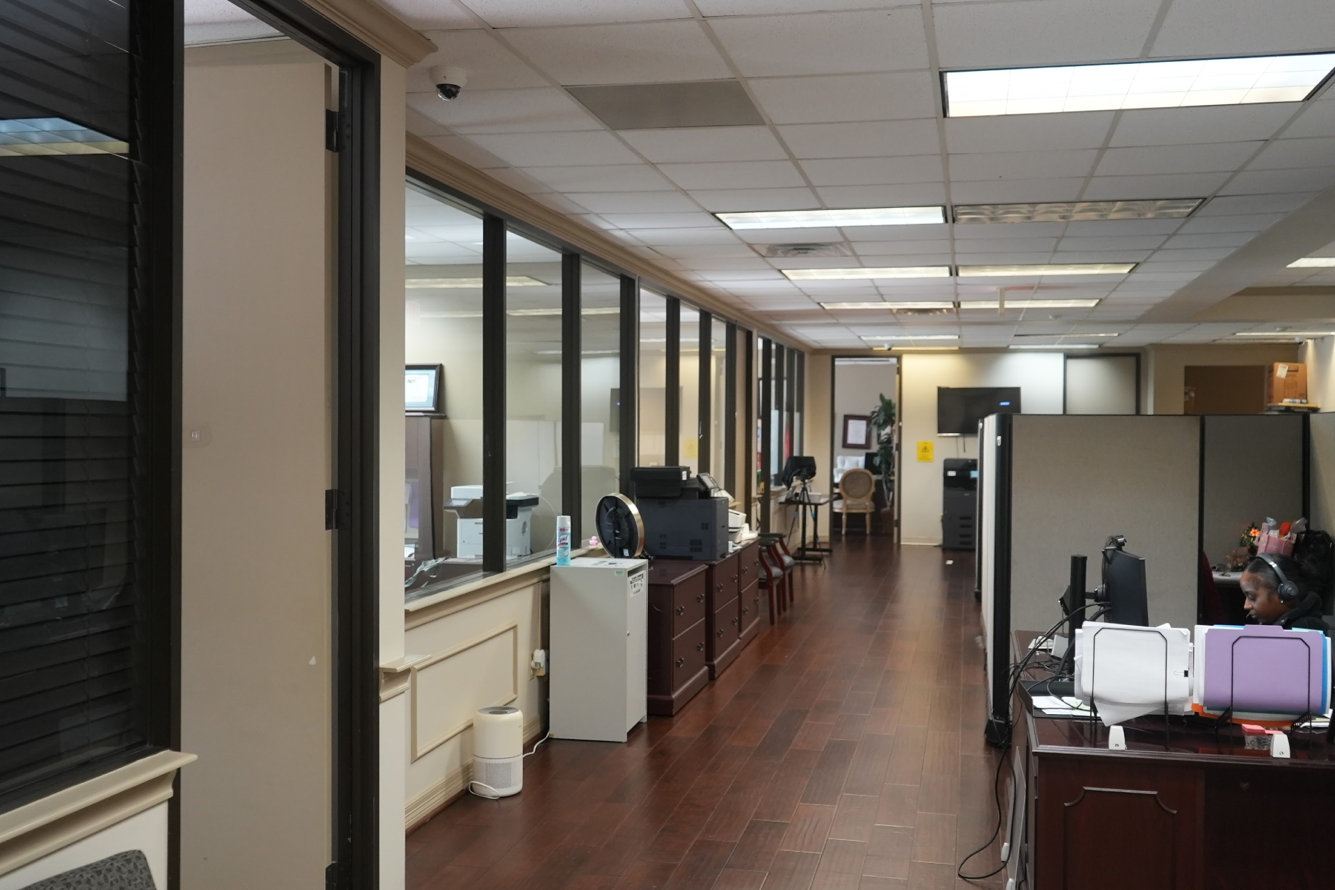 Office interior hallway with desks and workspace area