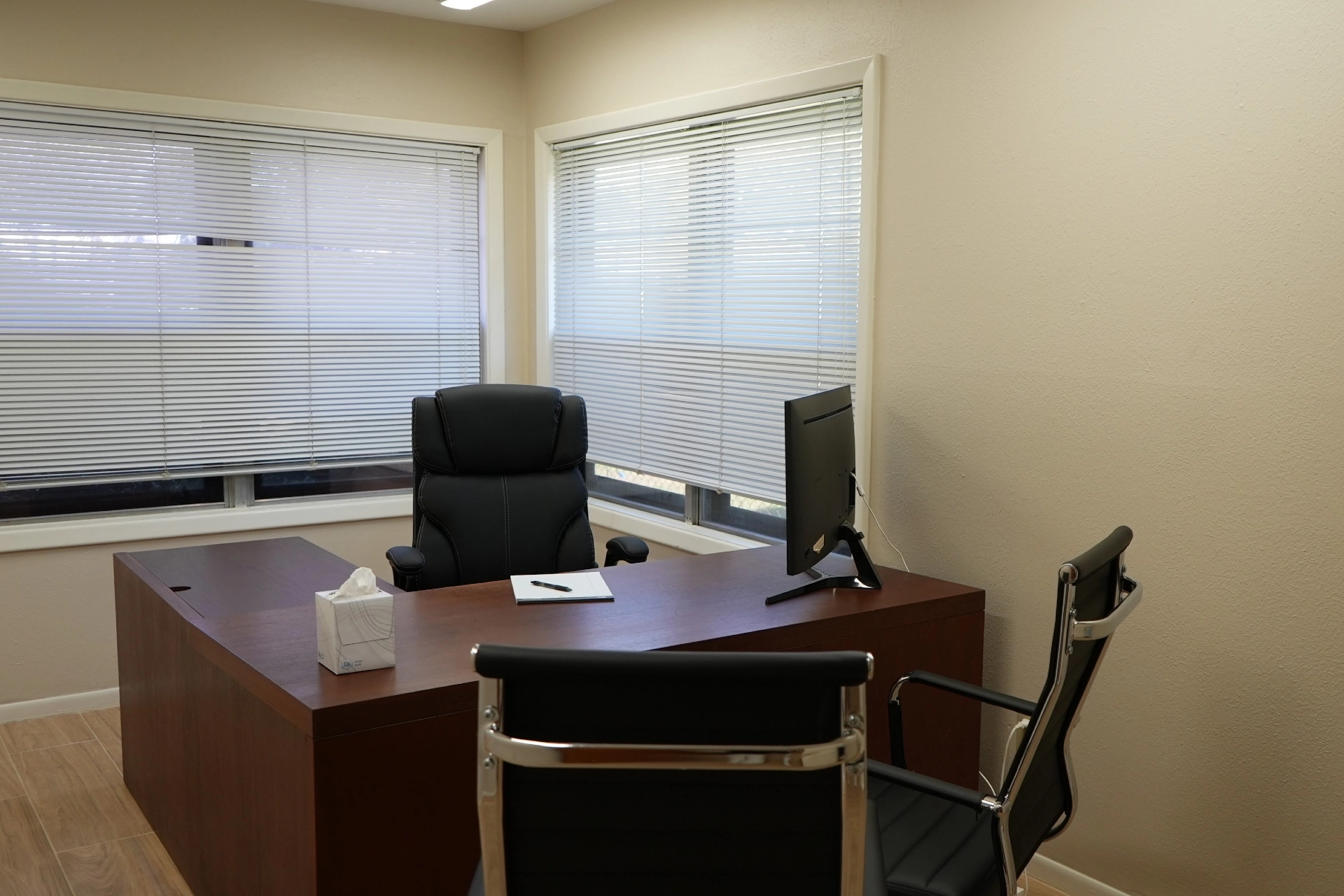 Private office at Humble location with desk and seating area