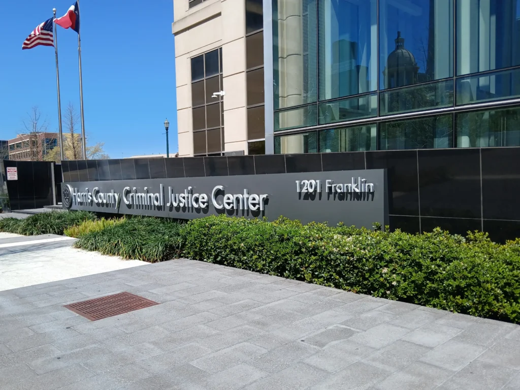 Harris County Domestic Relations Office near Harris County Criminal Justice Center sign and entrance