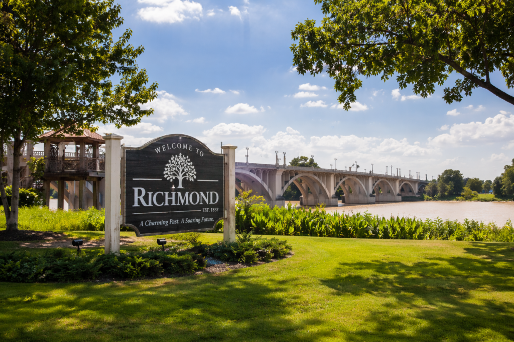Wide-angle summer view of Richmond, Texas with scenic bridge, river, and park landscape representing community setting for family law matters
