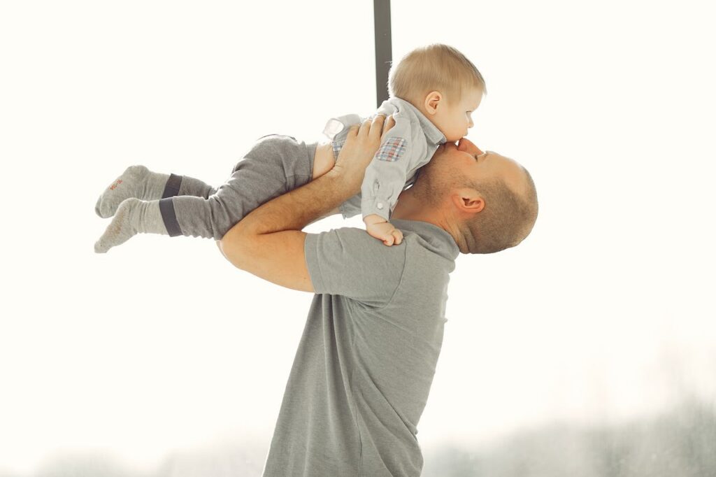 man lifting a child